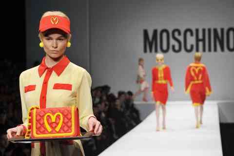 A model presents a creation for fashion house Moschino as part of the Milan's Women's fashion week Autumn/Winter 2014 collections on February 20, 2014. AFP PHOTO / TIZIANA FABI        (Photo credit should read TIZIANA FABI/AFP/Getty Images)